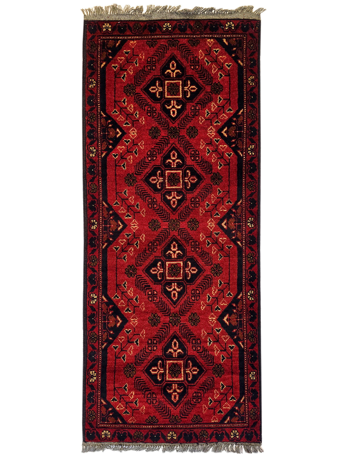 Red vertically oriented geometric rug with central diamond motifs and fringed top