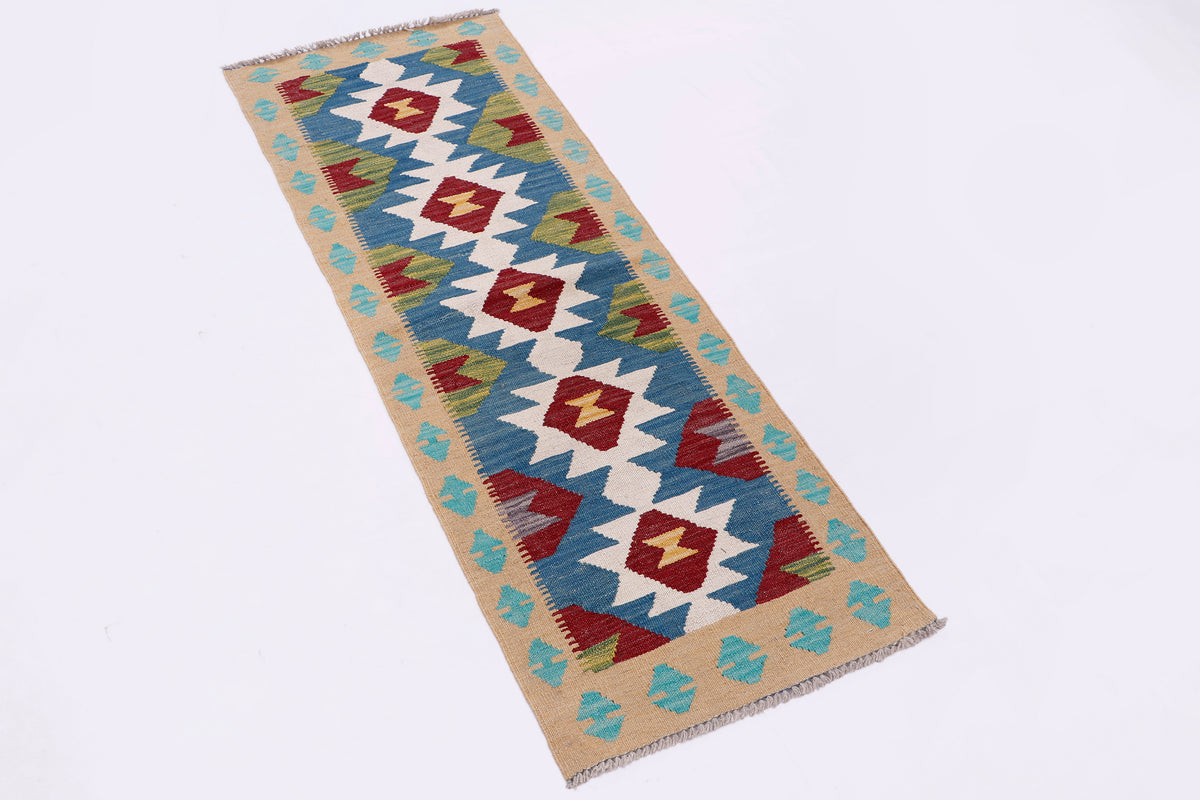 Rectangular kilim runner rug with blue, tan, red, and white geometric pattern