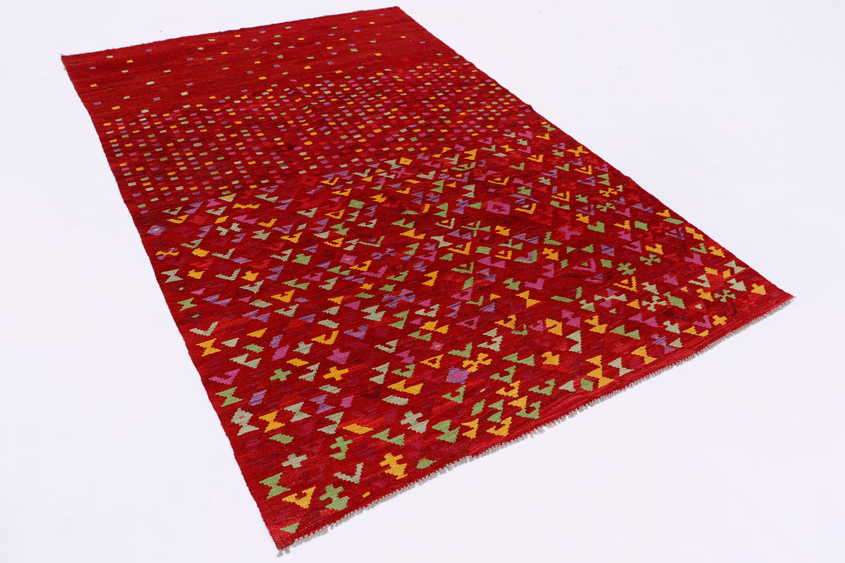 Crimson mosaic red kilim rug with multicolor geometric pattern, angled view