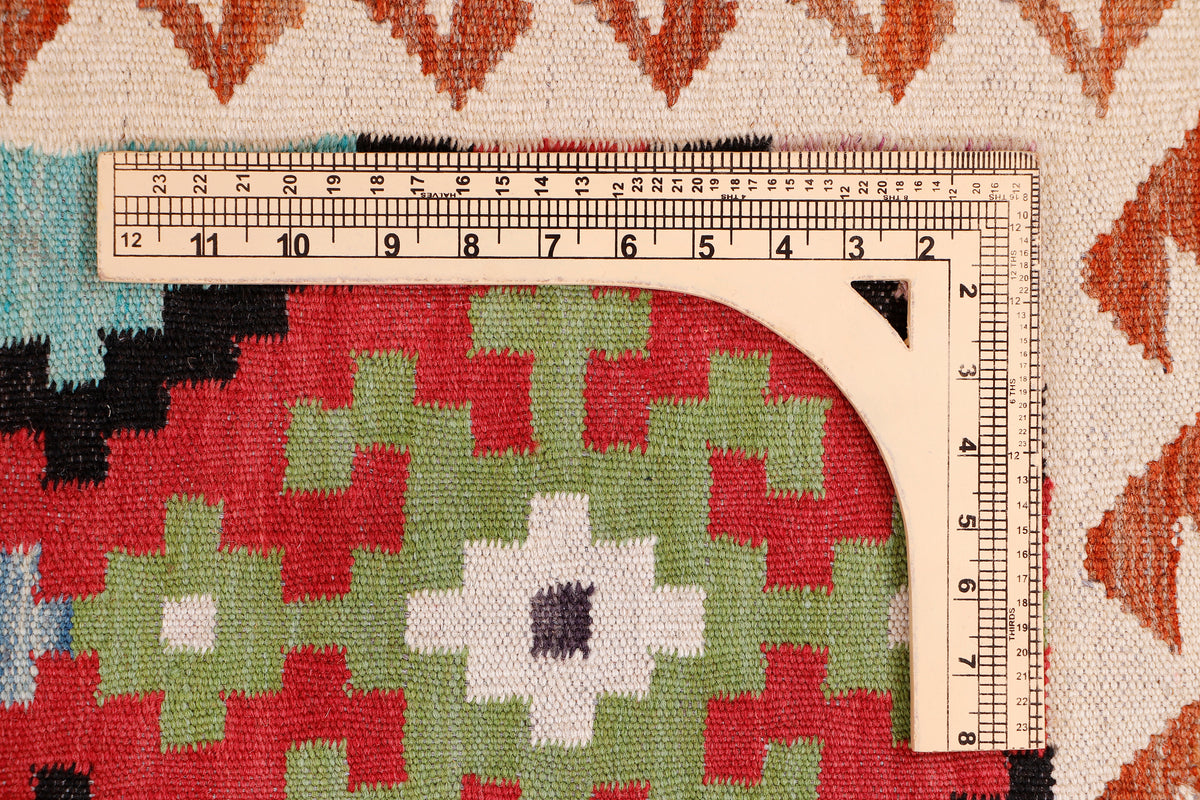 Desert Mirage red kilim rug with multicolor geometric pattern and cream ground