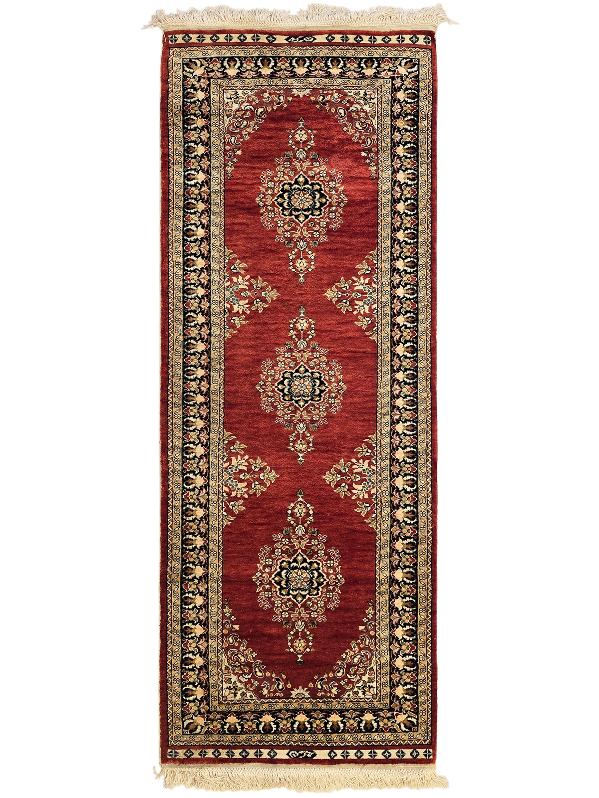 Hereke rug front view in deep red with three medallion motifs and beige fringe