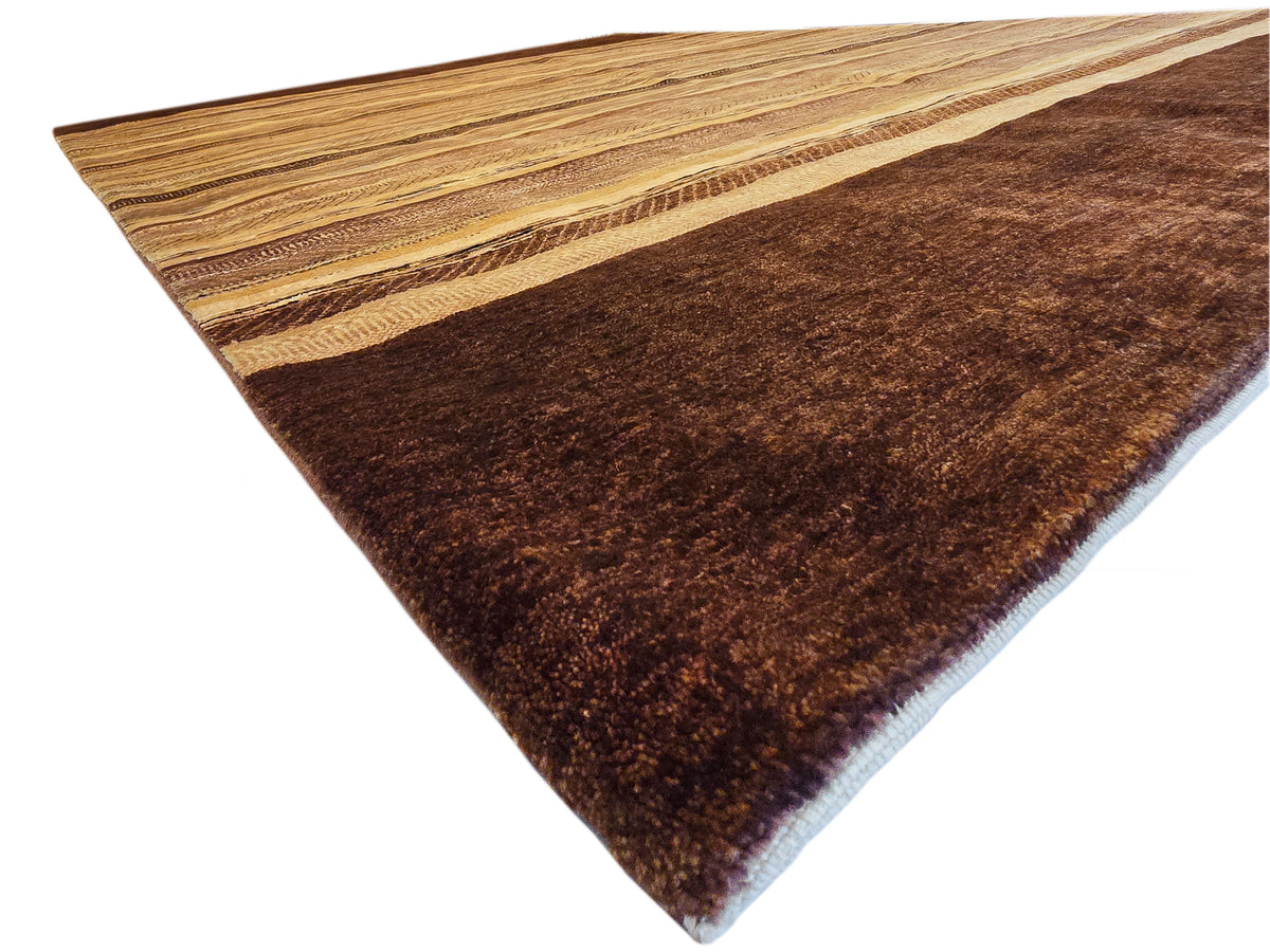 Rectangular rug corner with tan stripe bands over a dark brown background.