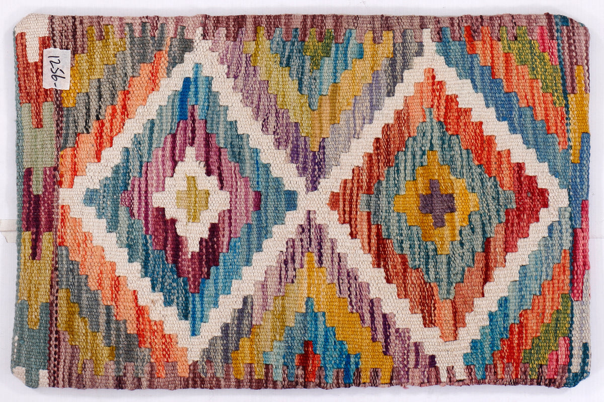 Kilim cushion cover close-up of blue diamond motifs with multicolor stitching