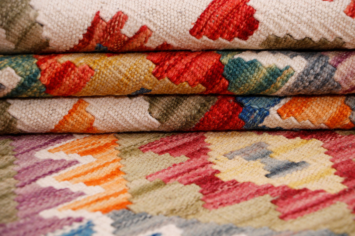 Rolled kilim rug edge with multicolor geometric pattern and textured weave