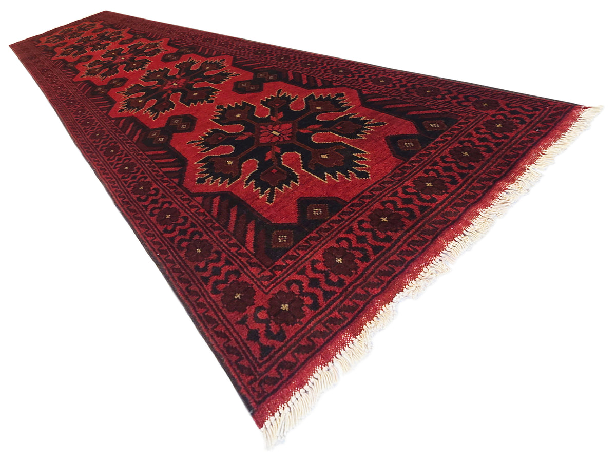 Maroon 290x79 area rug with geometric medallion pattern and cream fringe corners