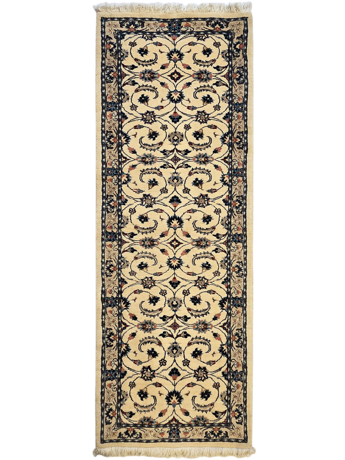 Tall narrow rug with cream-beige floral lattice pattern and dark blue outer frame, fringe.