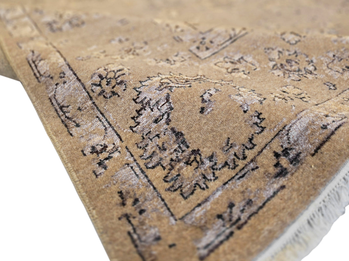 Beige modern rug close-up of floral pattern with short fringe and textured pile