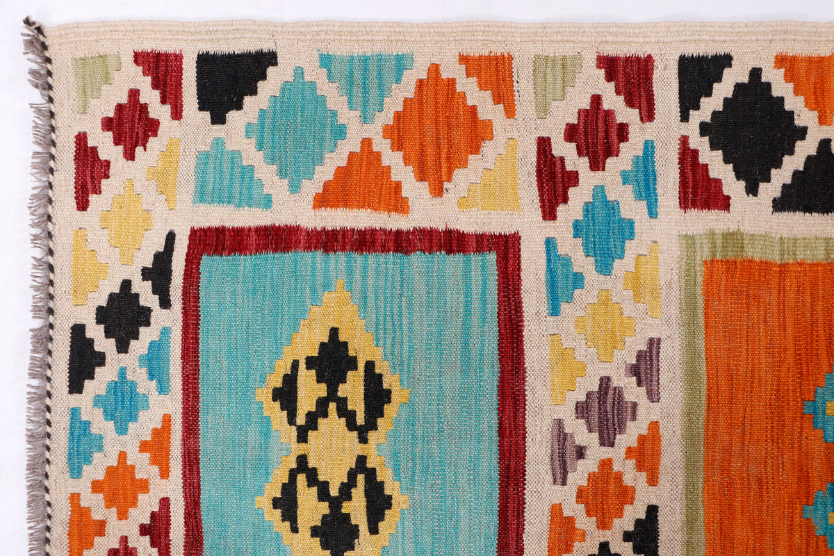 Multicolor kilim rug close-up with geometric motifs and short fringe edges