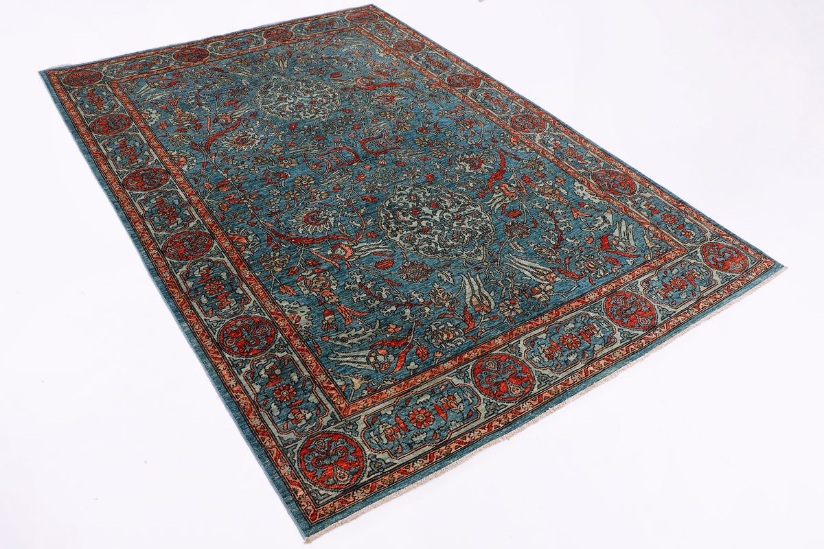 Blue oriental rug with ornate teal field and red-orange border pattern