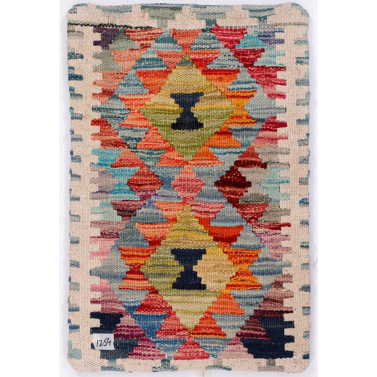 Blue kilim cushion cover with a woven geometric pattern in red, orange, blue, and yellow