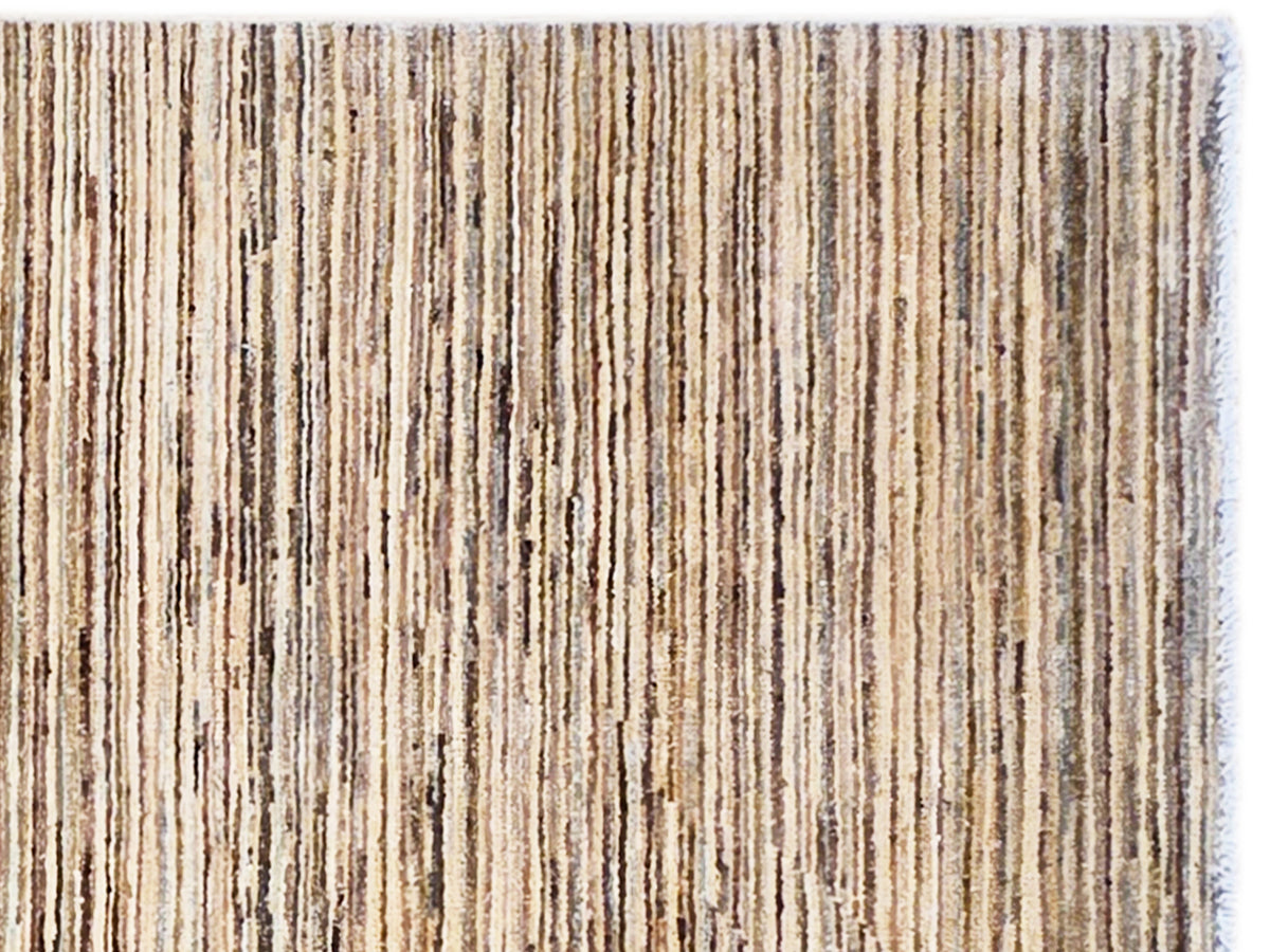 Striped Ziegler rug close-up with dense textured pile in beige, brown, and dark tones
