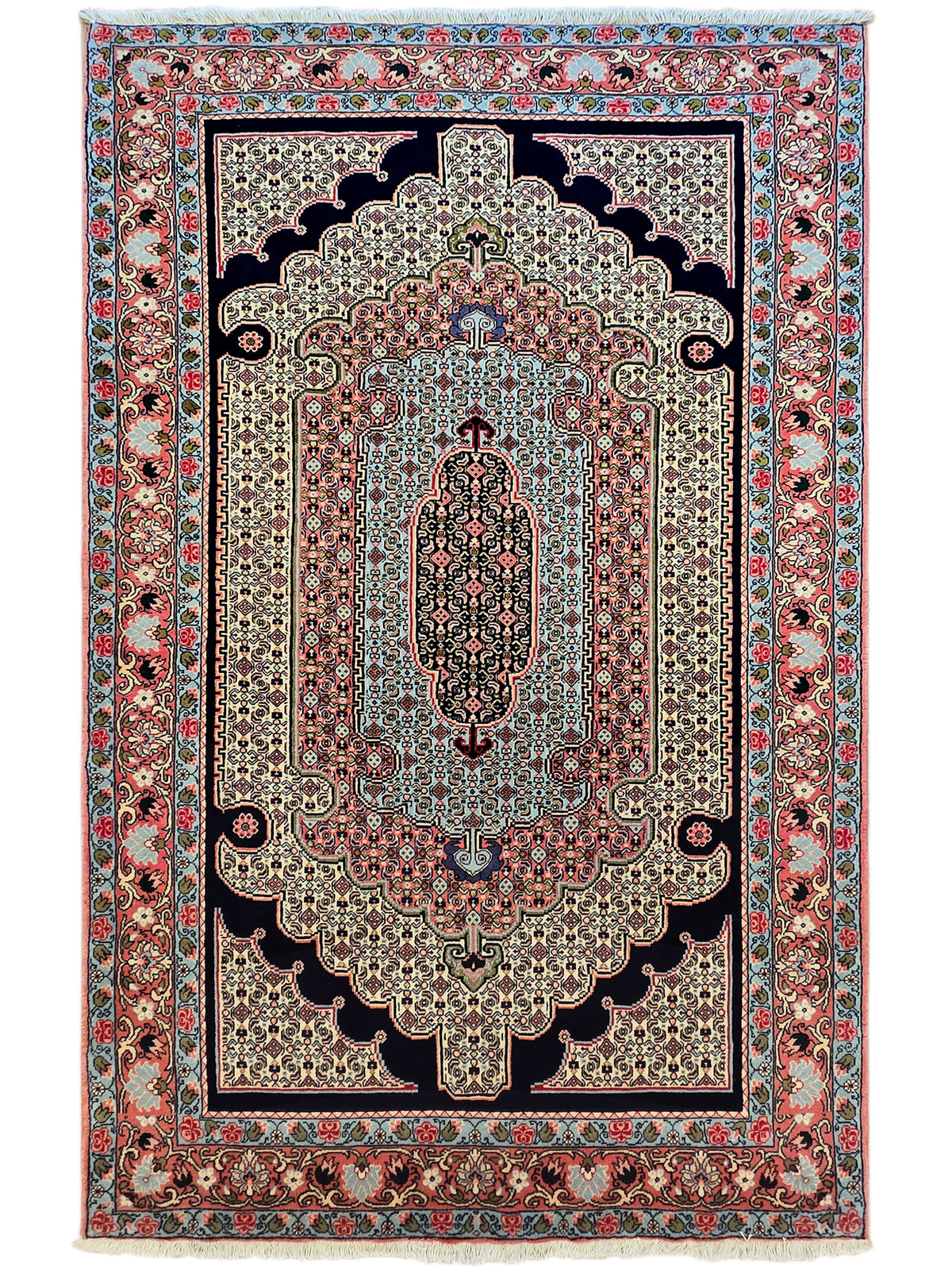 Vertical ornate area rug with floral motifs in red, blue, and cream; fringed look.