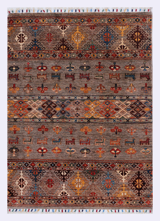 Grey rug with wide patterned bands featuring star and cross motifs in orange and blue.