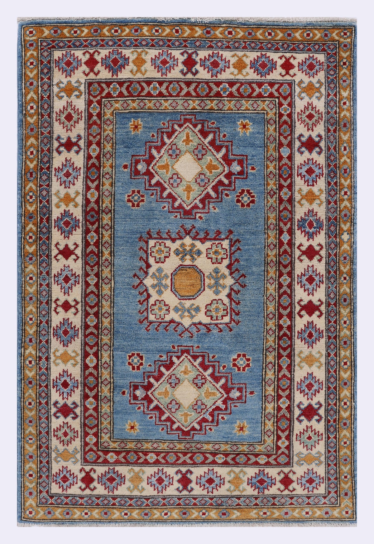 Blue rug 144x96 cm with ornate geometric border and multicolor center medallion.