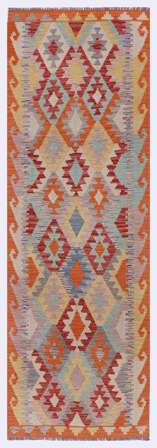 Orange kilim rug with multicolor diamond and triangle geometric pattern