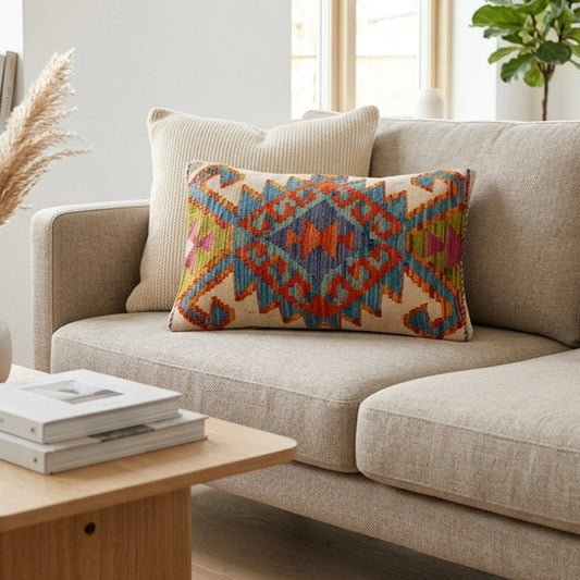 Geometric kilim cushion cover in off-white with multicolor pattern, front view