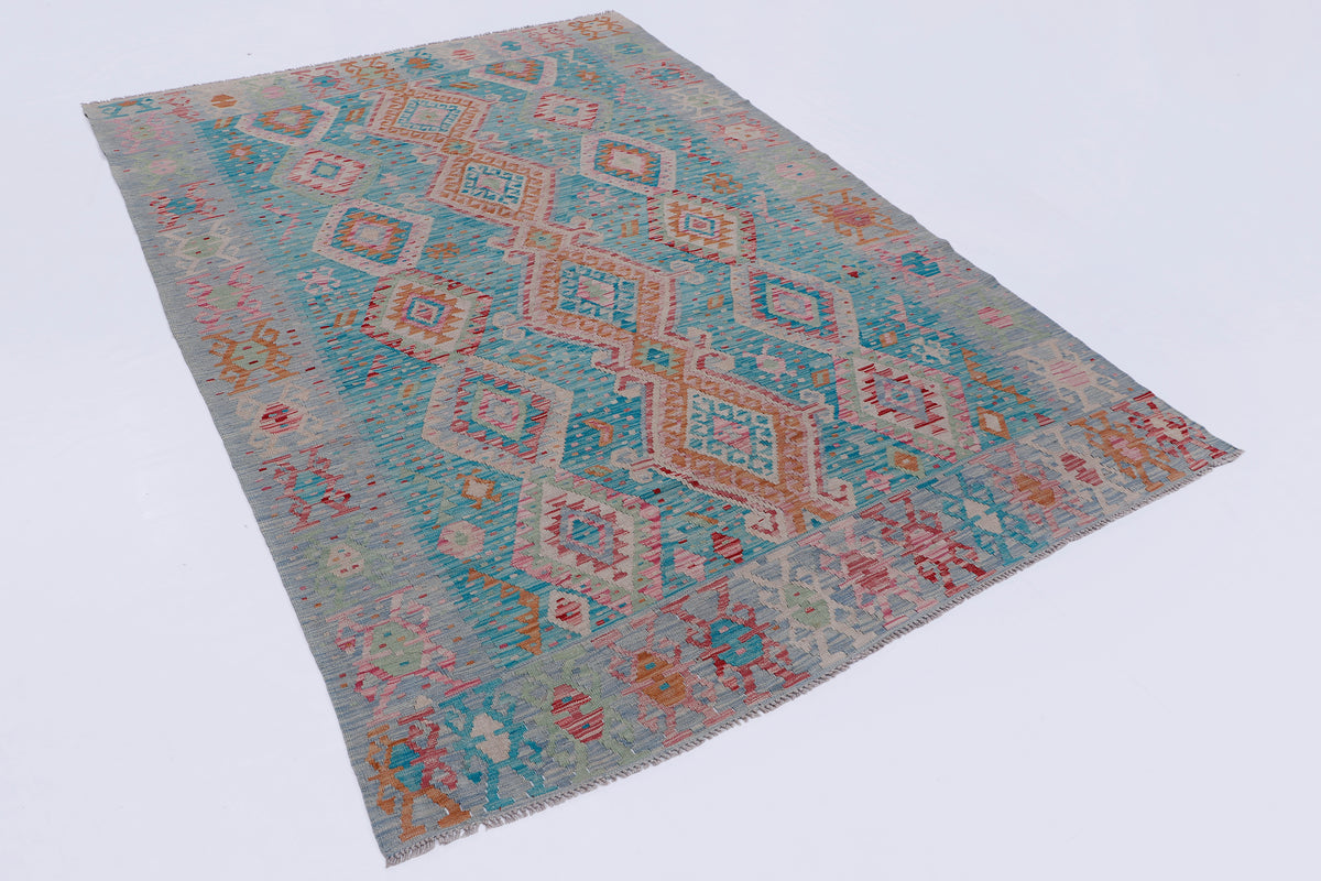 Folded blue kilim rug with multicolor geometric design and flat weave