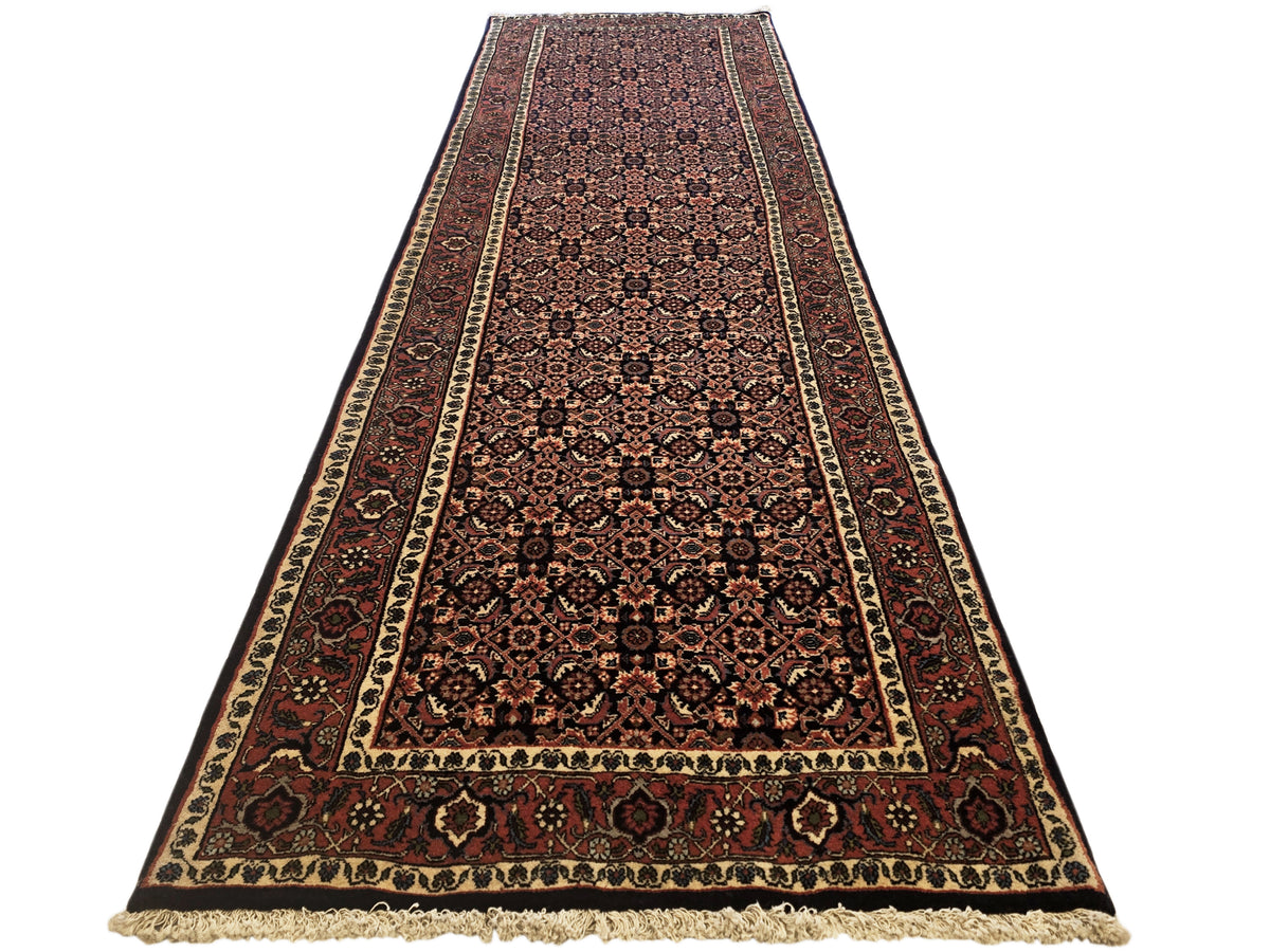 Bidjar rug with dark red field, navy and beige borders, intricate medallion pattern.