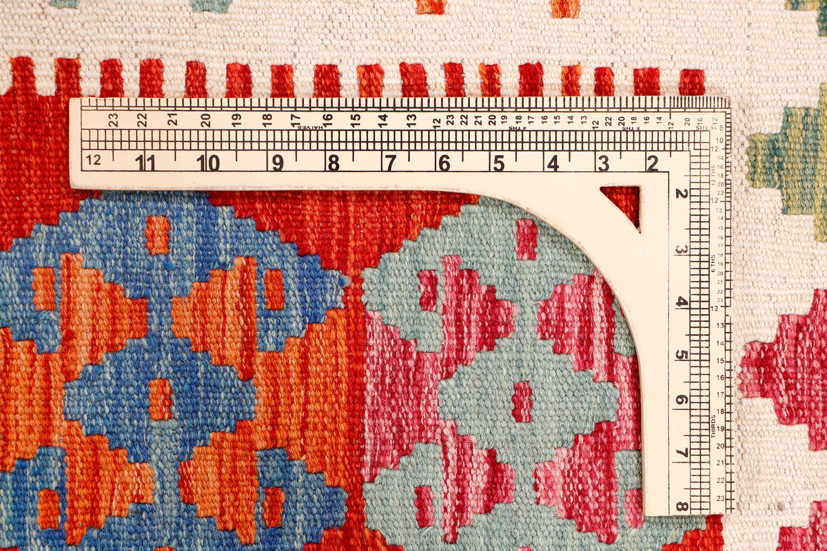 Kilim runner rug with cream, red, and blue geometric medallion pattern border