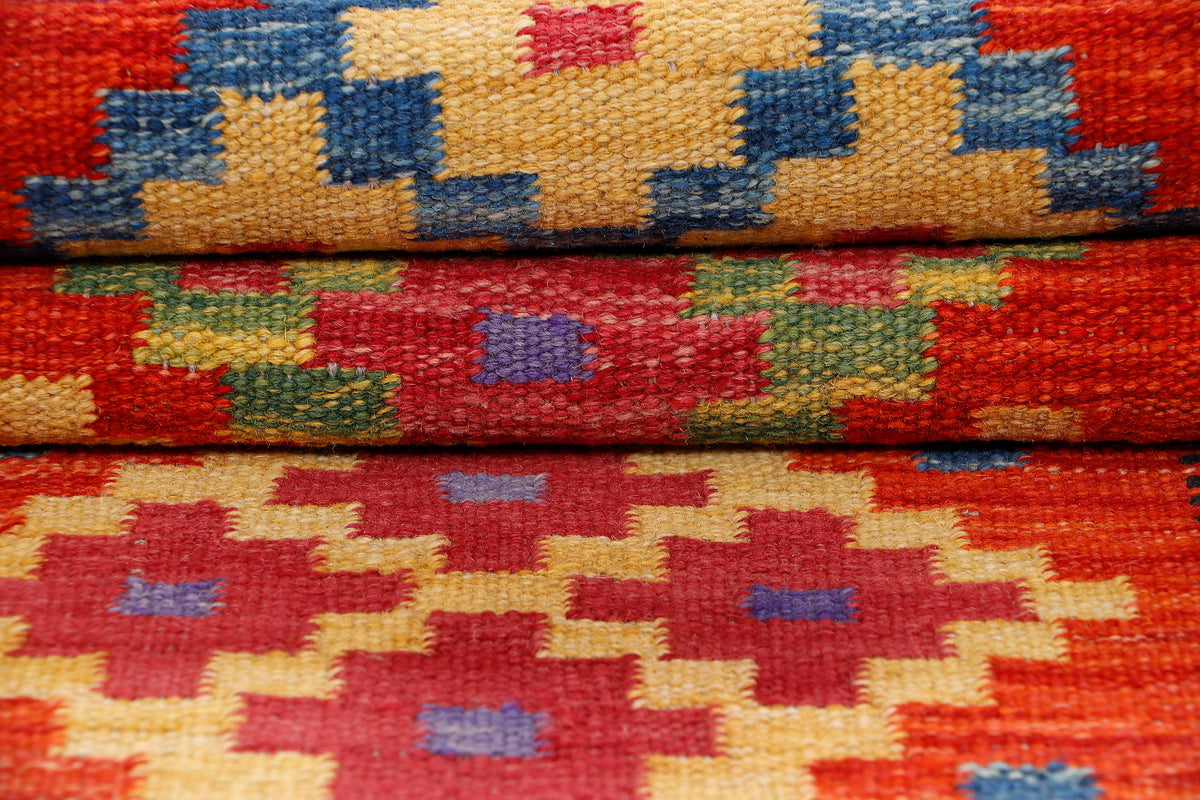Colorful kilim rug with red, blue, yellow, and green geometric pattern rows