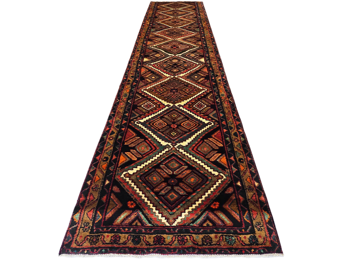 Hamedan rug runner with geometric diamond pattern in rust, navy, and cream