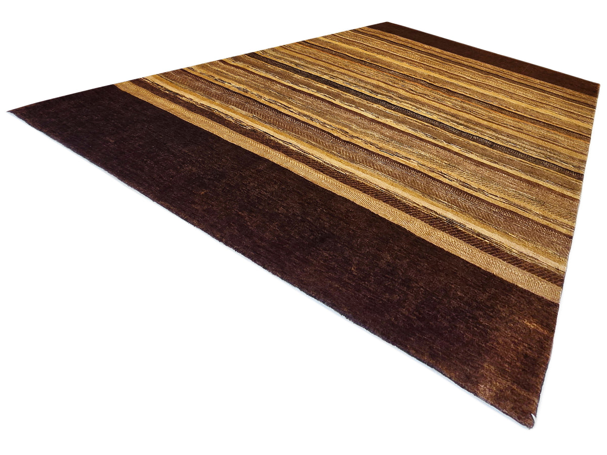 Rectangular area rug with tan and dark brown stripes, shown from a corner angle.