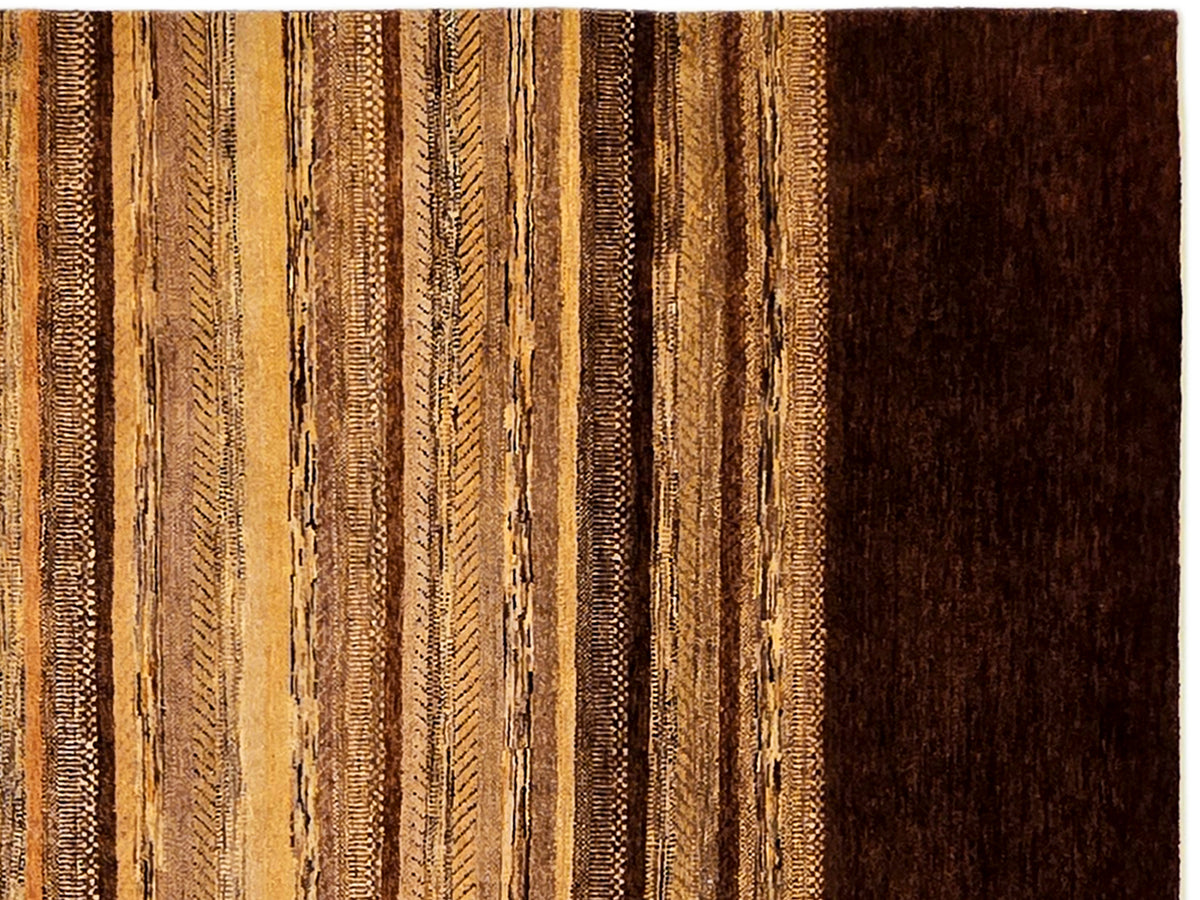 Rug surface close-up with vertical tan stripes and a dark brown border.