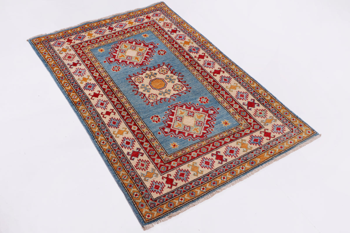 Blue, orange, and red ornamental area rug with geometric medallion