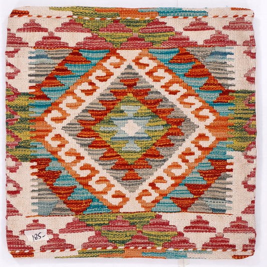Kilim cushion cover close-up with colorful geometric diamond motif and zigzag borders