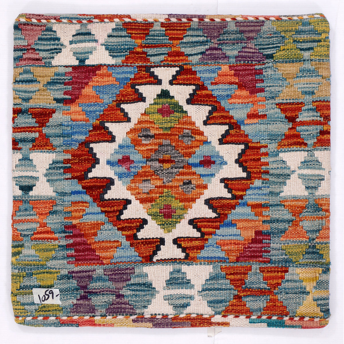 Square kilim cushion cover with multicolor geometric diamond pattern, visible stitched border