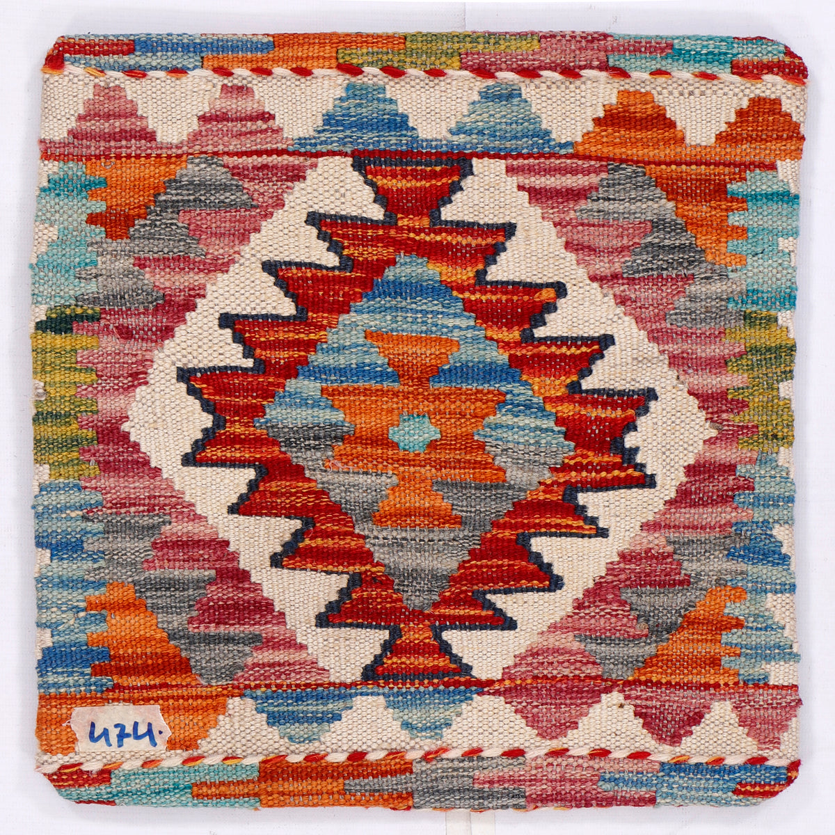 Multicolor diamond kilim cushion front with zigzag border, woven textured surface