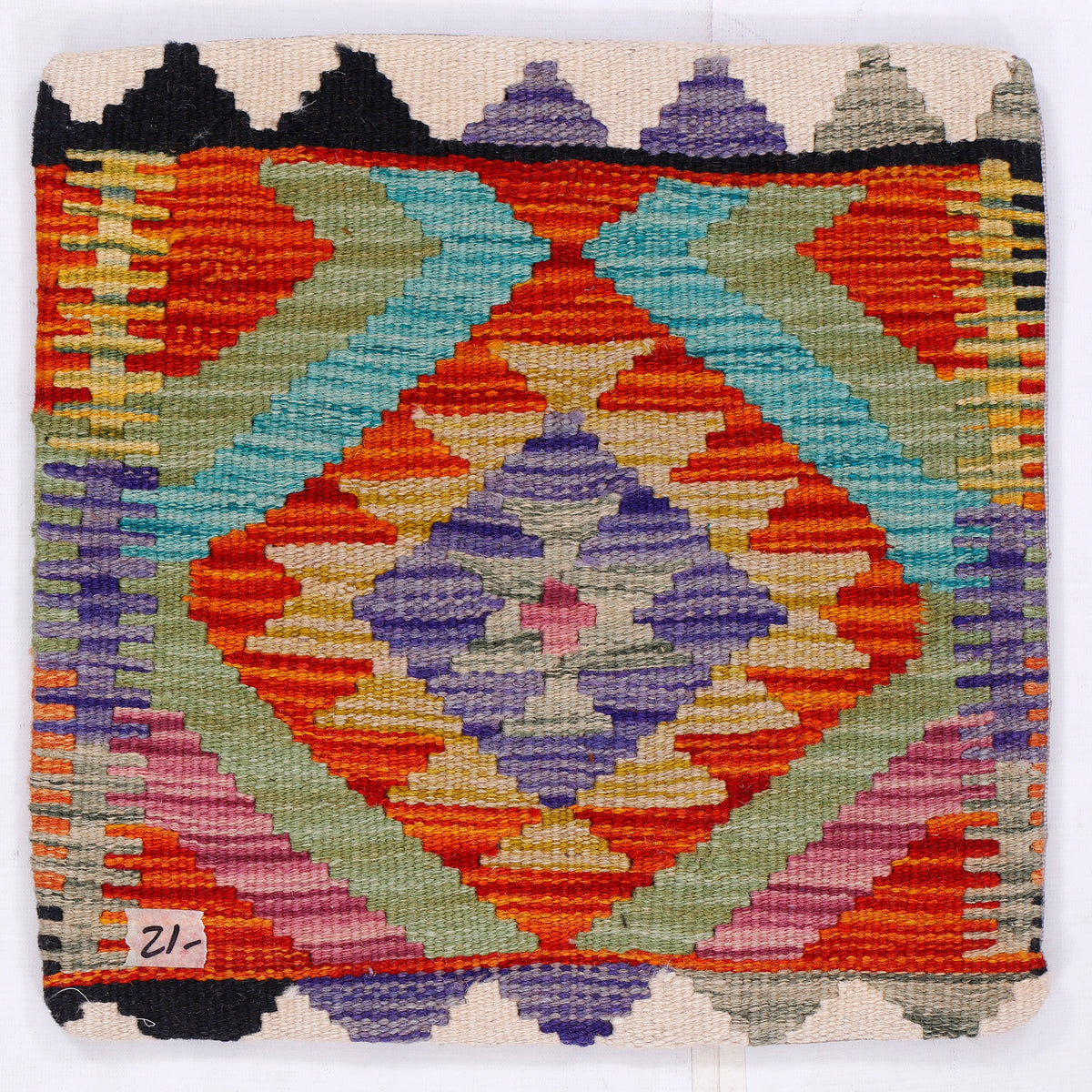 Kilim cushion cover with geometric diamond pattern in orange, blue, purple, and black