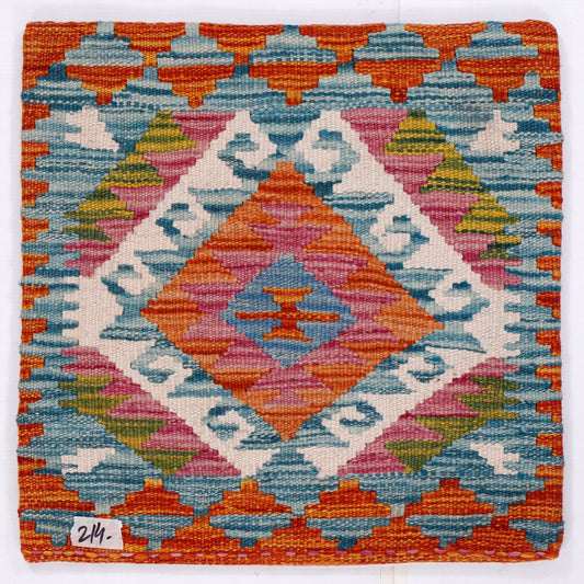 Blue kilim cushion cover close-up with layered multicolor geometric diamond pattern