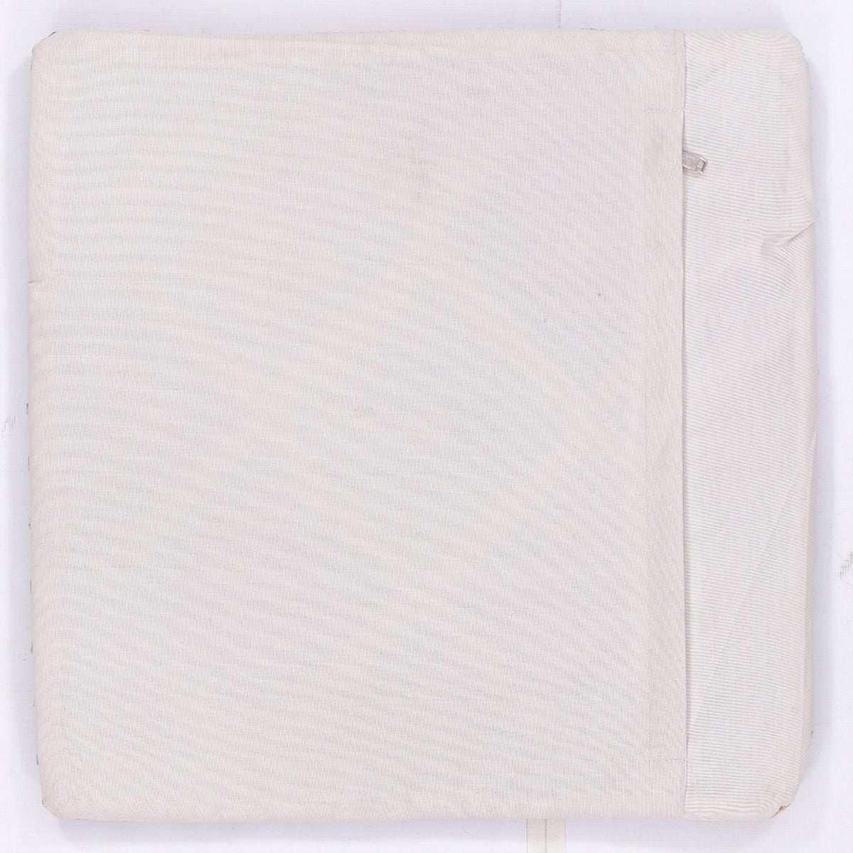 Cream cushion cover with subtle textured weave and concealed seam, square 45x45 cm