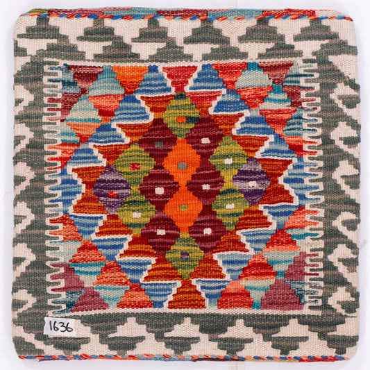 Kilim cushion cover 45x45 cm, close view of colorful geometric tiles with red edging
