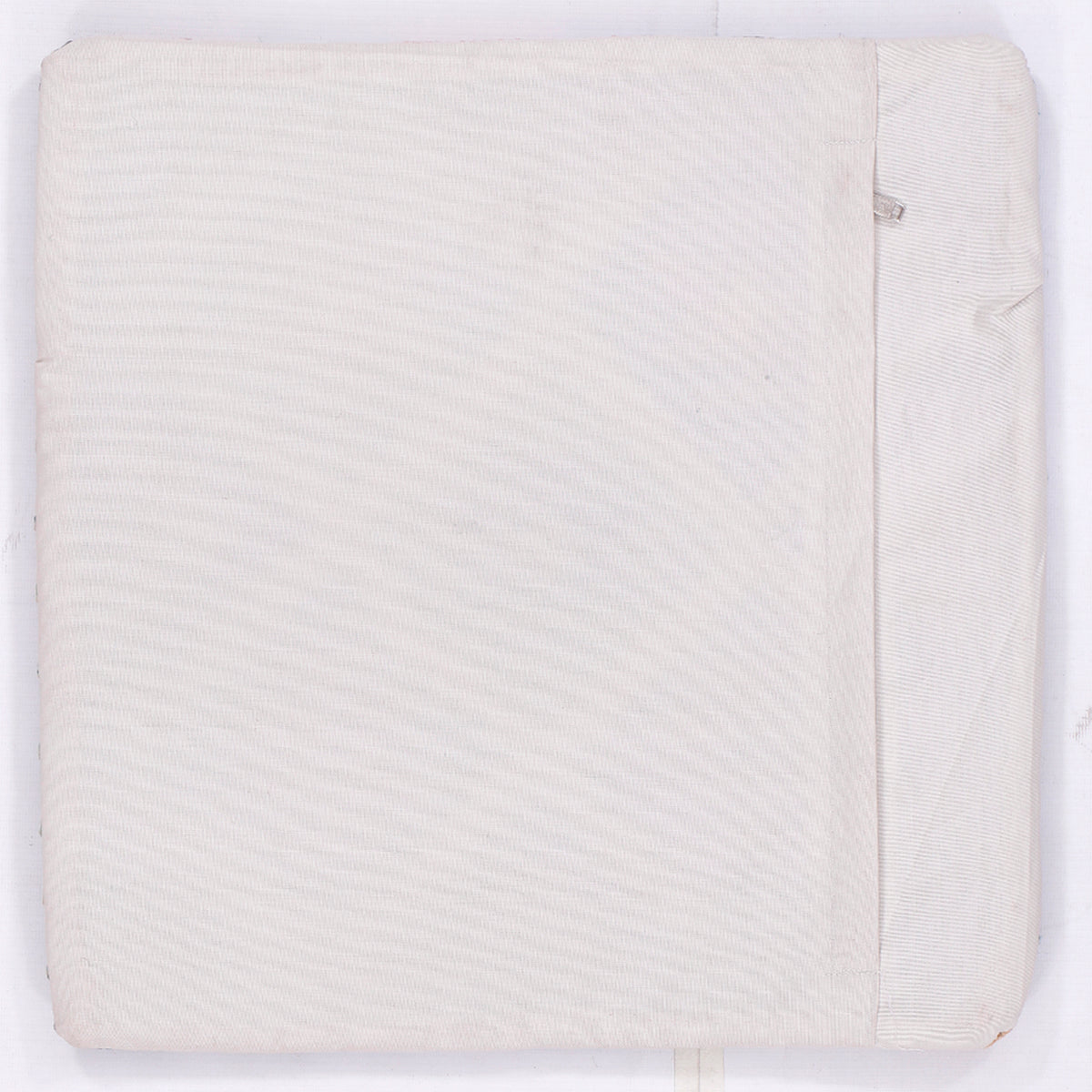 Off-white kilim cushion cover back panel with stitched edge and zipper