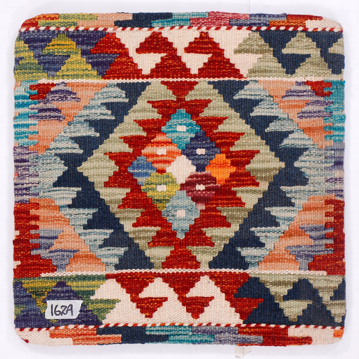Square kilim cushion with multicolor geometric medallion pattern on blue base