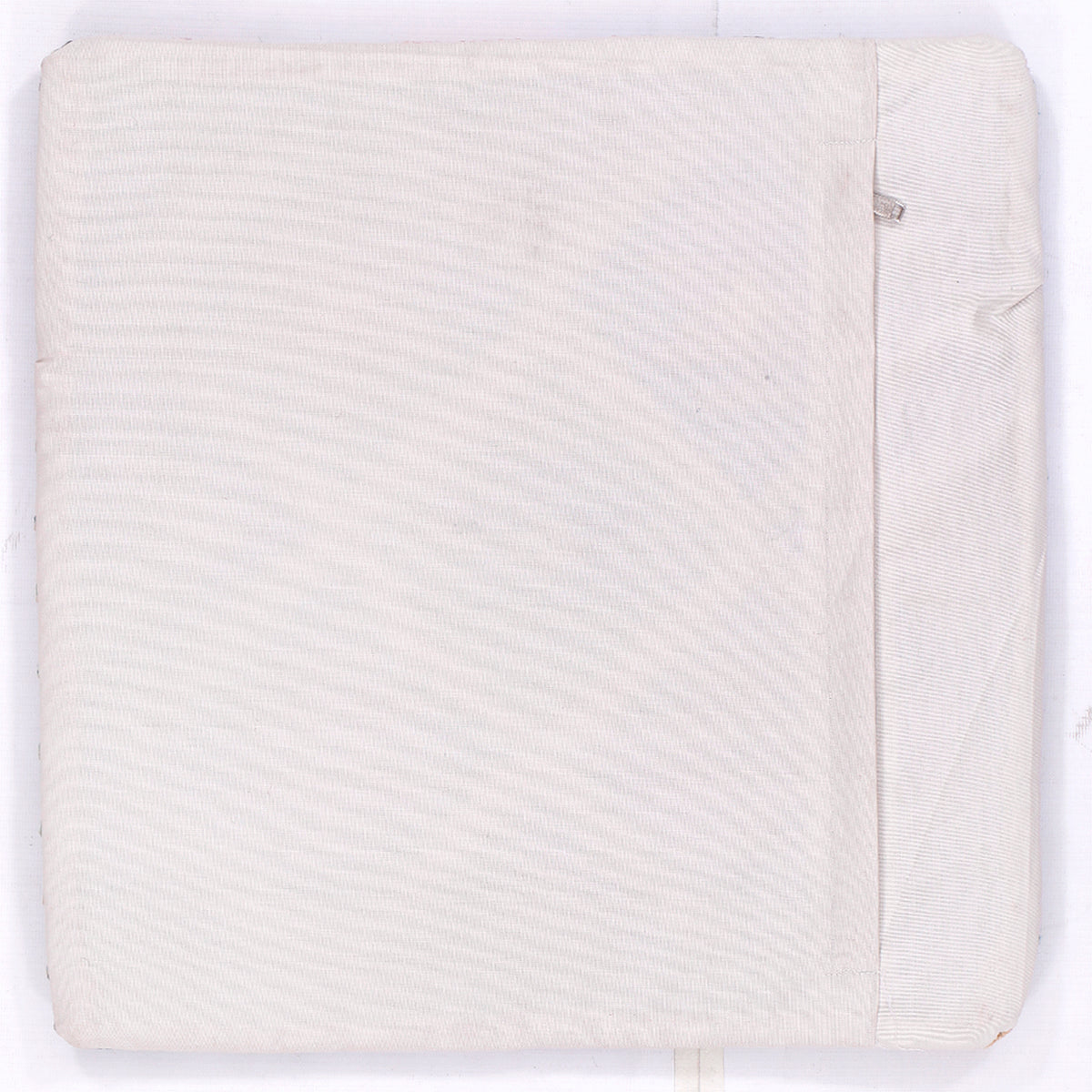Plain white kilim cushion cover with concealed edge seam, back view