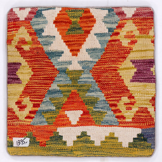 Kilim cushion cover with orange, blue, and green geometric pattern front
