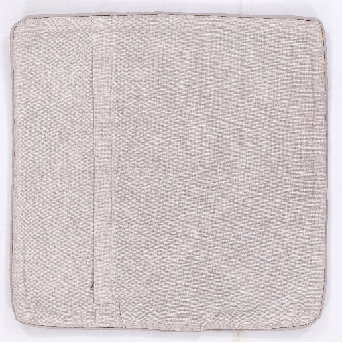 Tribal kilim cushion back, plain light beige fabric with stitched seam