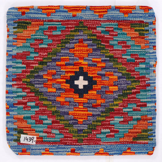 Multicolor kilim cushion cover close-up, blue border with multicolor geometric star motif