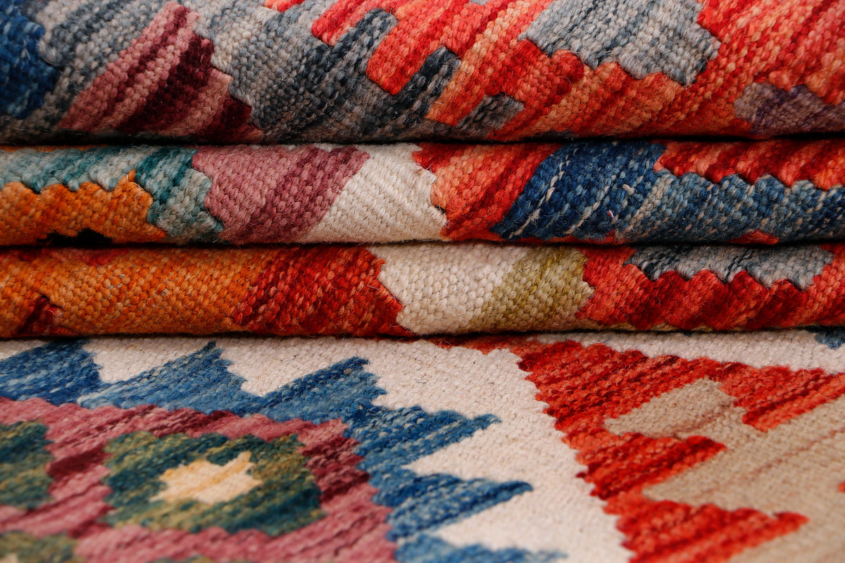 Kilim rug fabric close-up showing multicolor woven geometric motifs