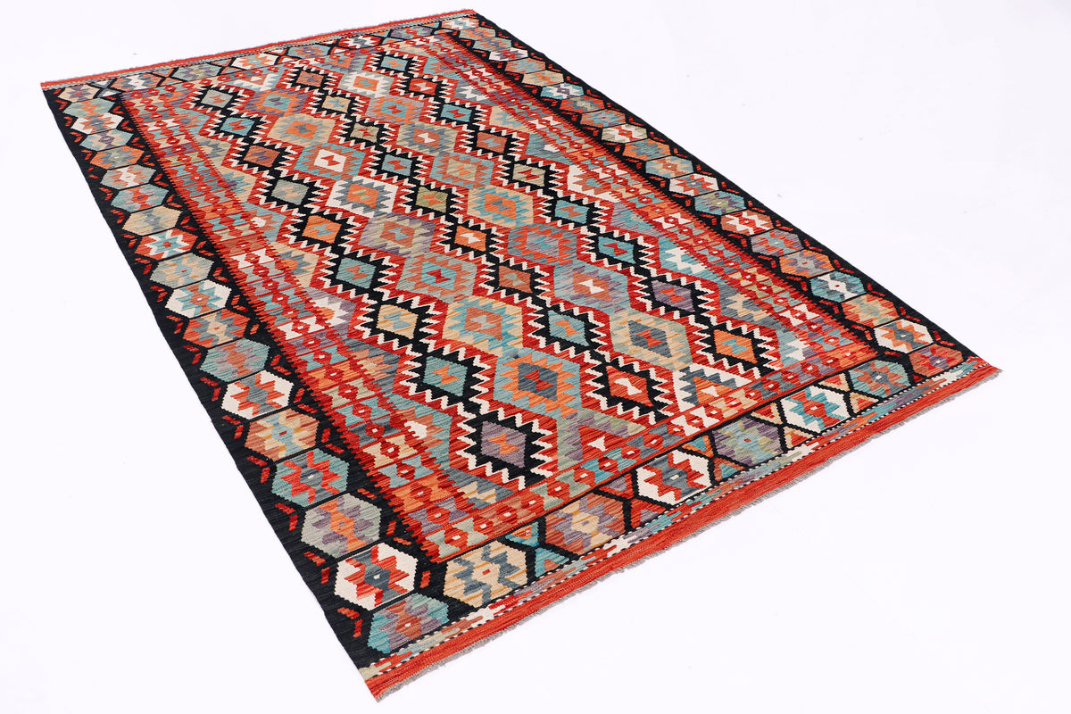 Kilim rug with bold geometric pattern in red, teal, orange, gray, cream, and black