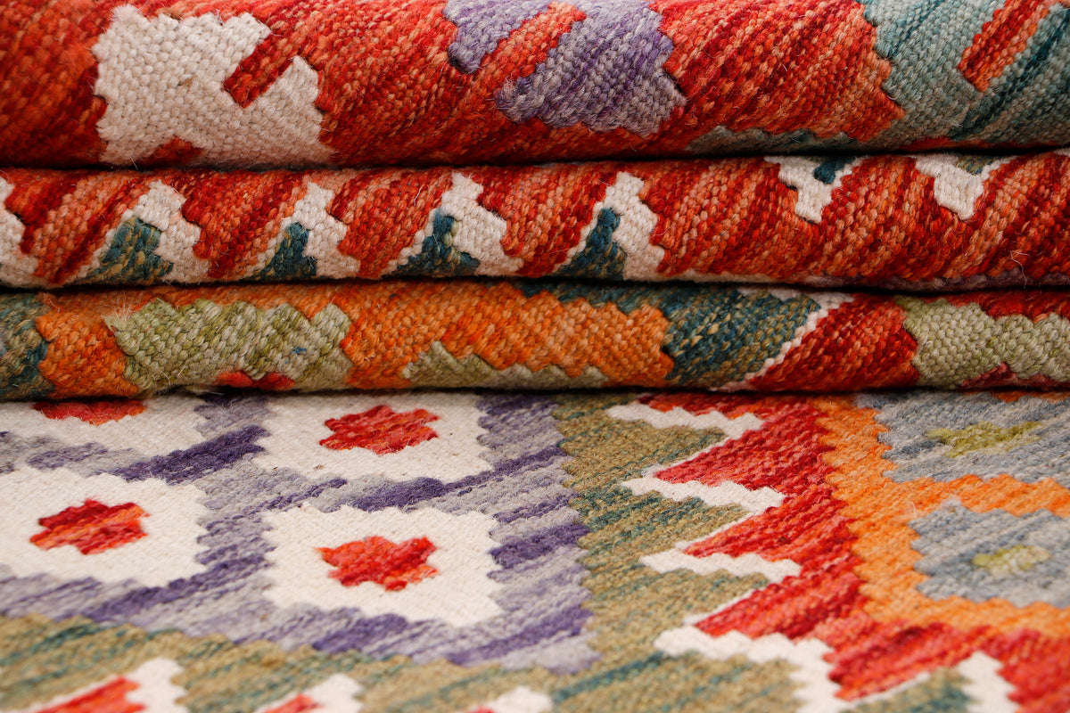 Rolled kilim rug showing multicolor geometric pattern and woven texture