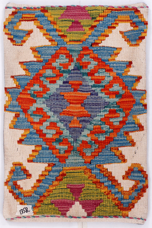Kilim cushion cover front with multicolor geometric pattern on off-white fabric