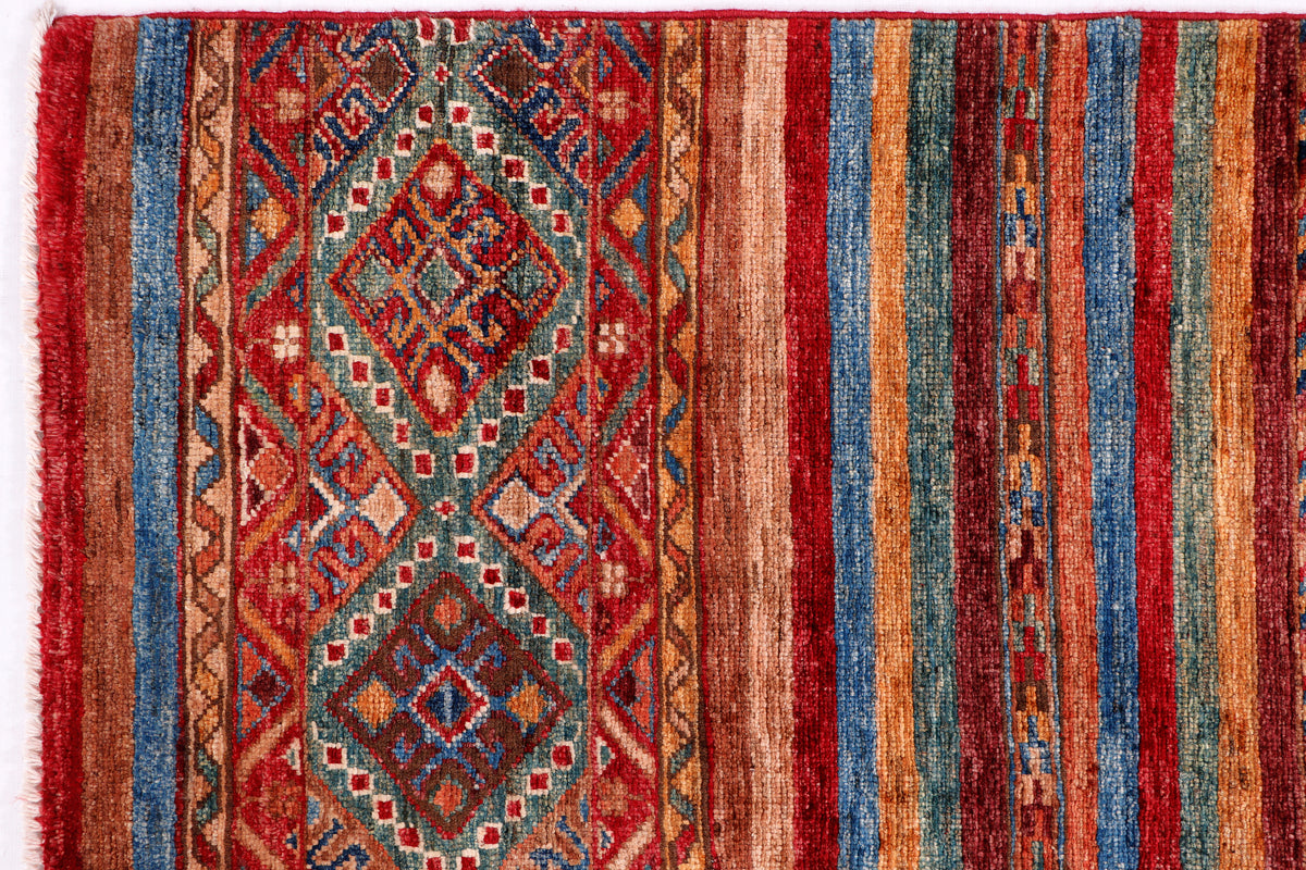 Red wool rug panel with diamond medallion and vertical blue stripes