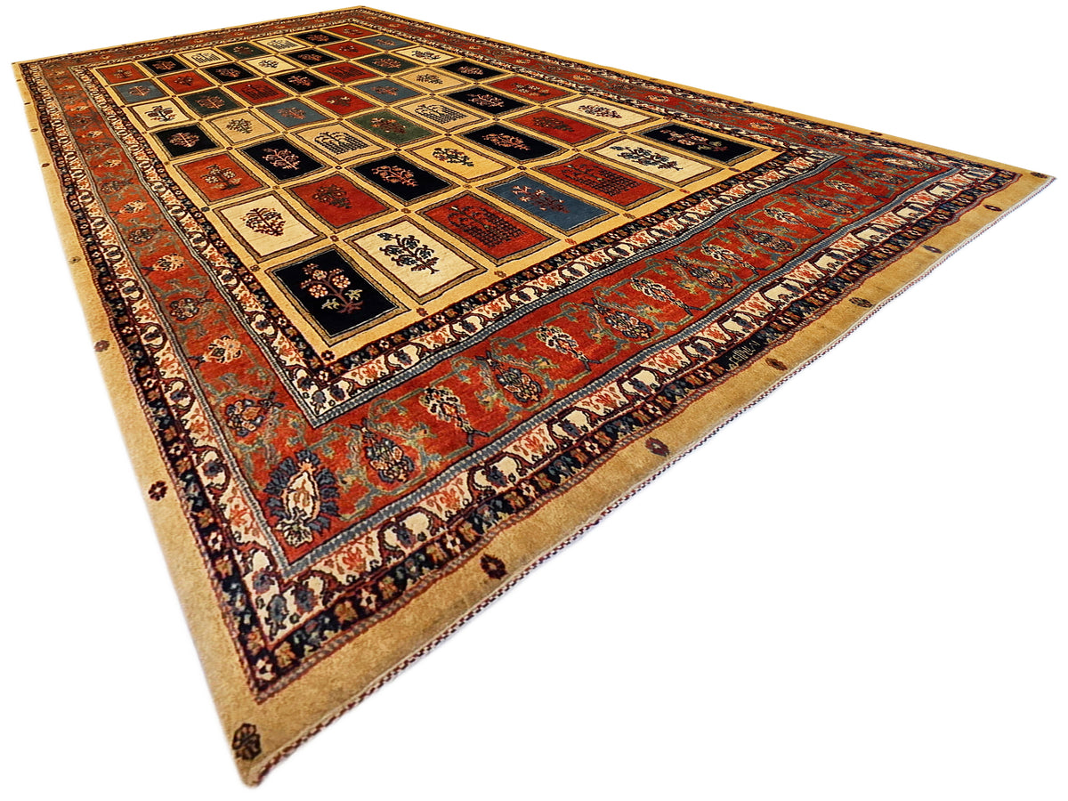 Oriental-style rug featuring geometric panels, red and blue accents, and patterned border