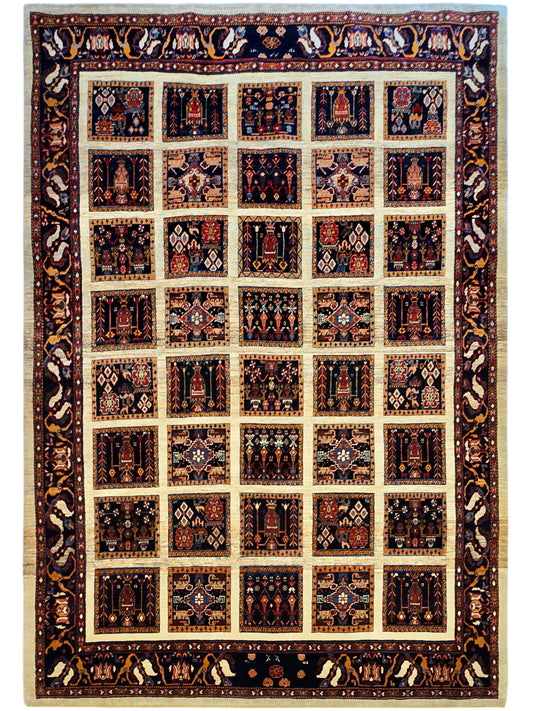 Loribaft rug, navy and rust patchwork squares with beige grid and ornate border