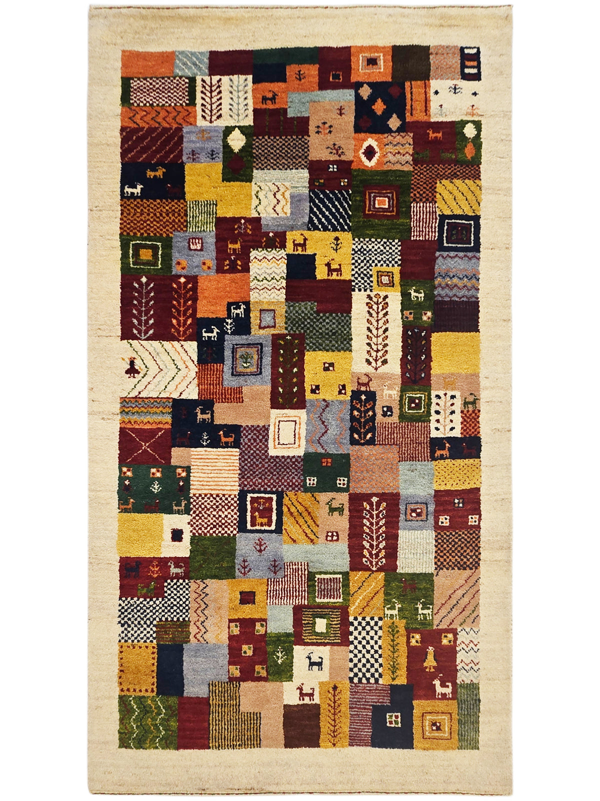 Full view of Loribaft patchwork rug with colorful geometric squares on beige.
