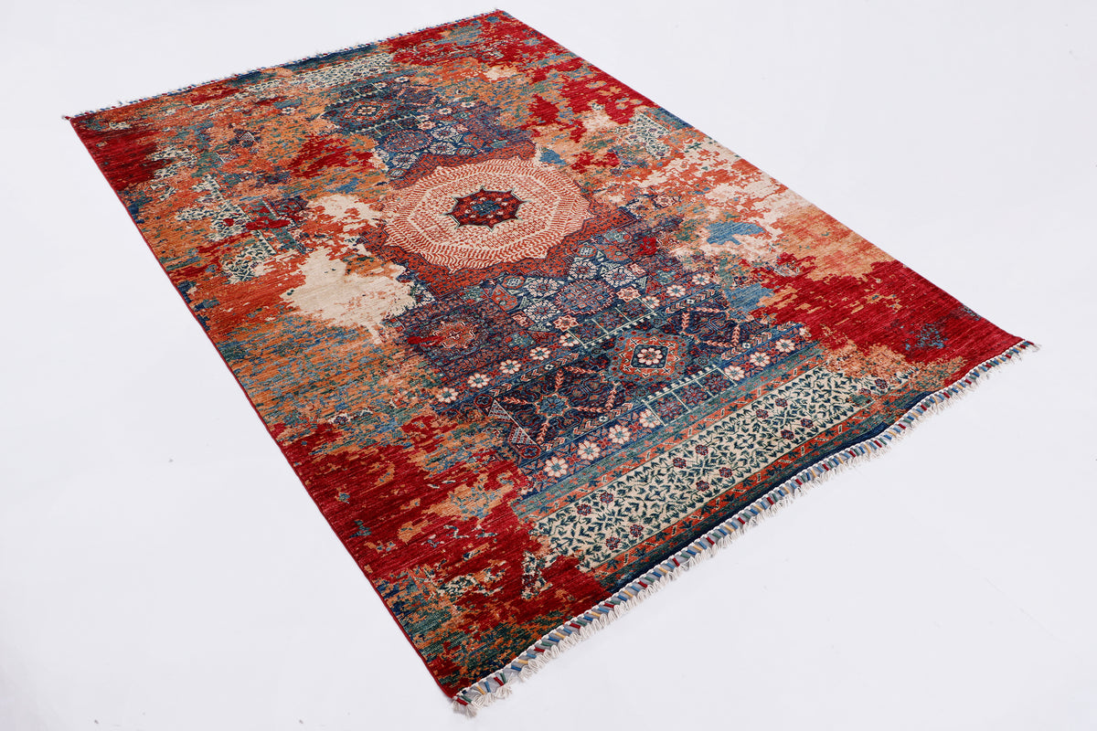 Red medallion kilim rug with blue and cream distressed pattern, rectangular